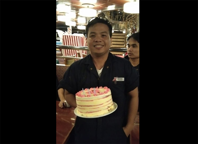 cruise ship crew with cake